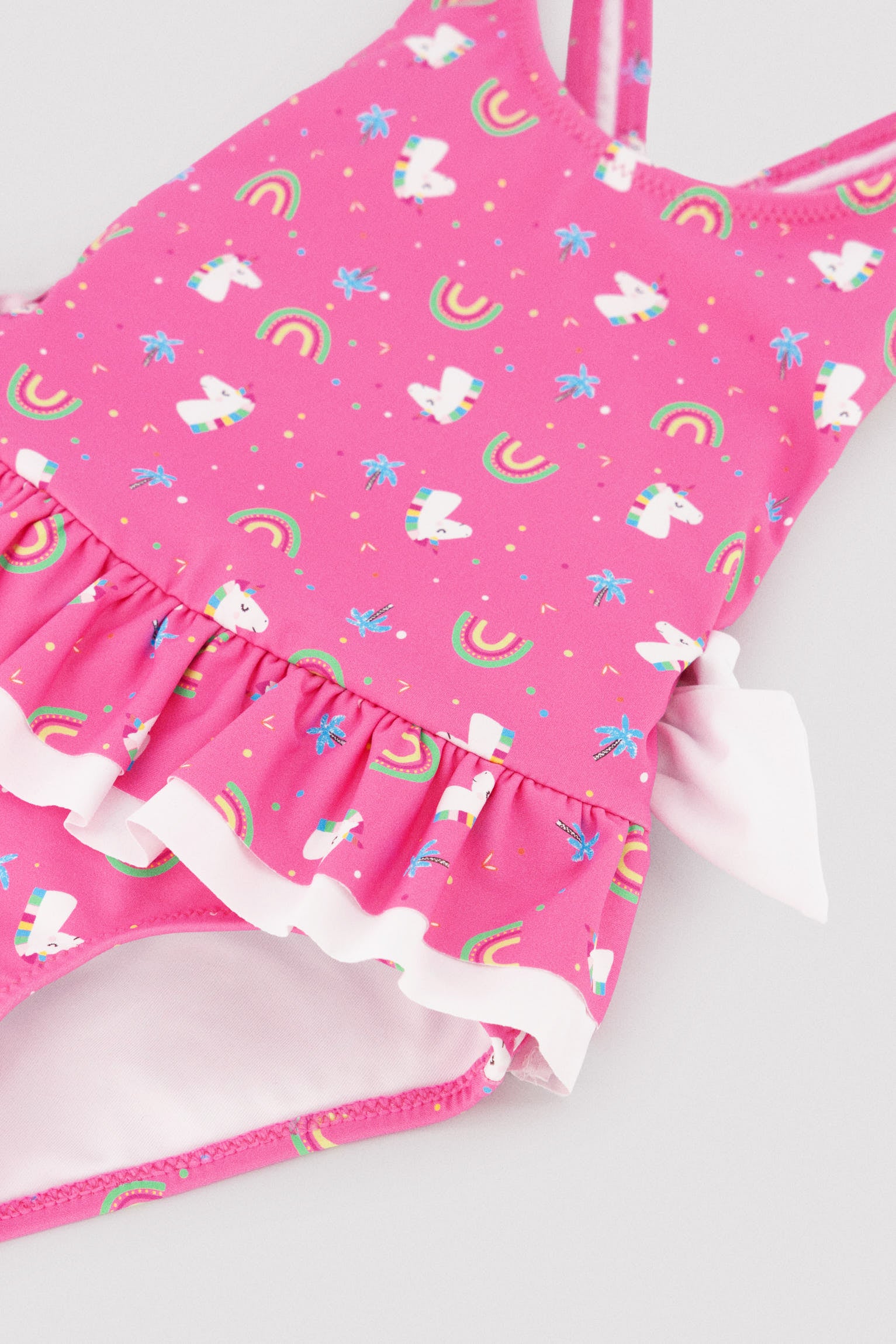Bañador niña detalles volantes y lazos estampado unicornios - Ysabel Mora
