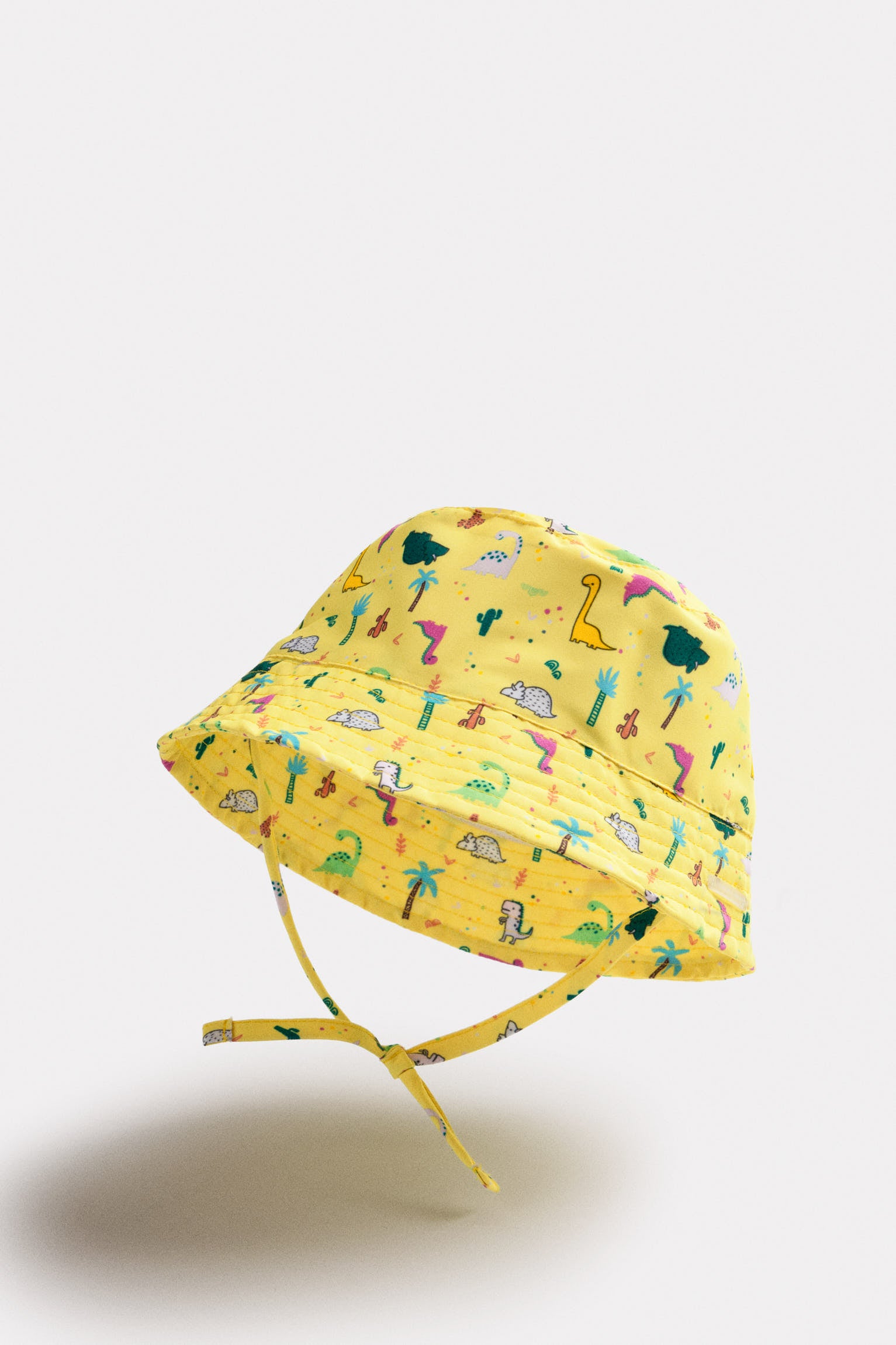 Gorro de playa bebé ala recta estampado dinosaurios - Ysabel Mora