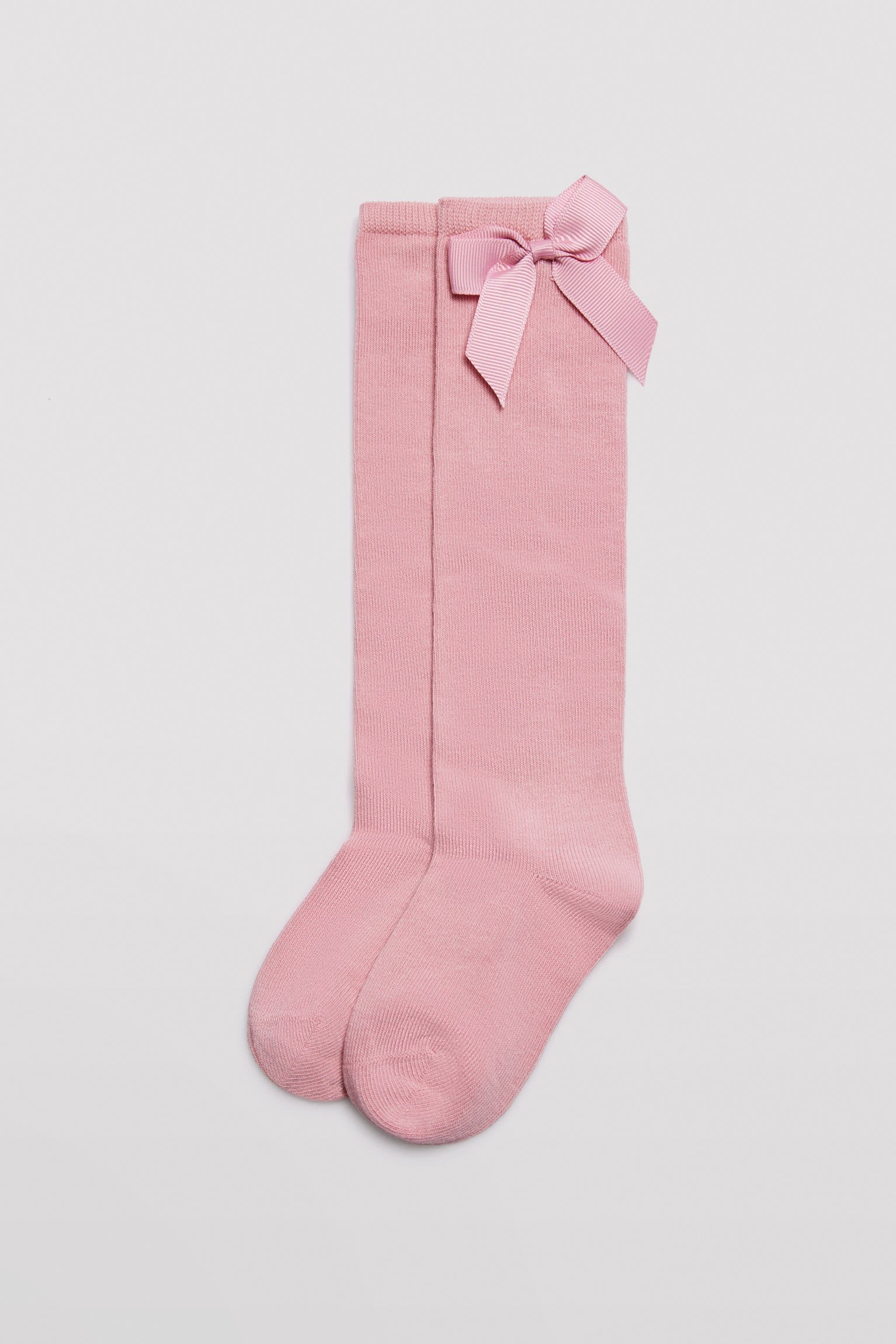 Chaussette longue pour enfant avec détail nœud rose