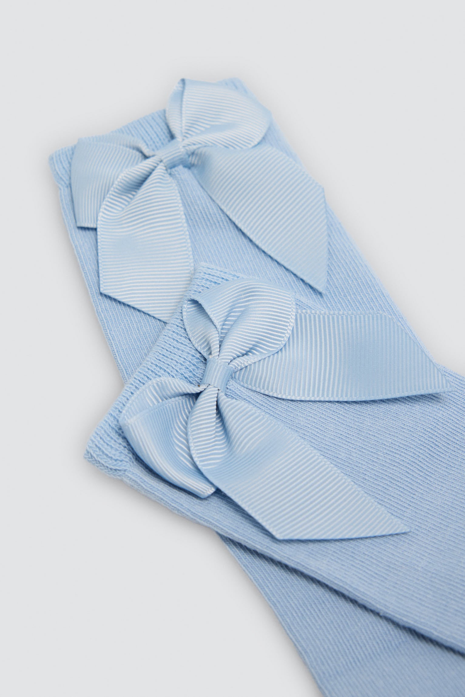 Chaussettes hautes enfant bleues détail nœud