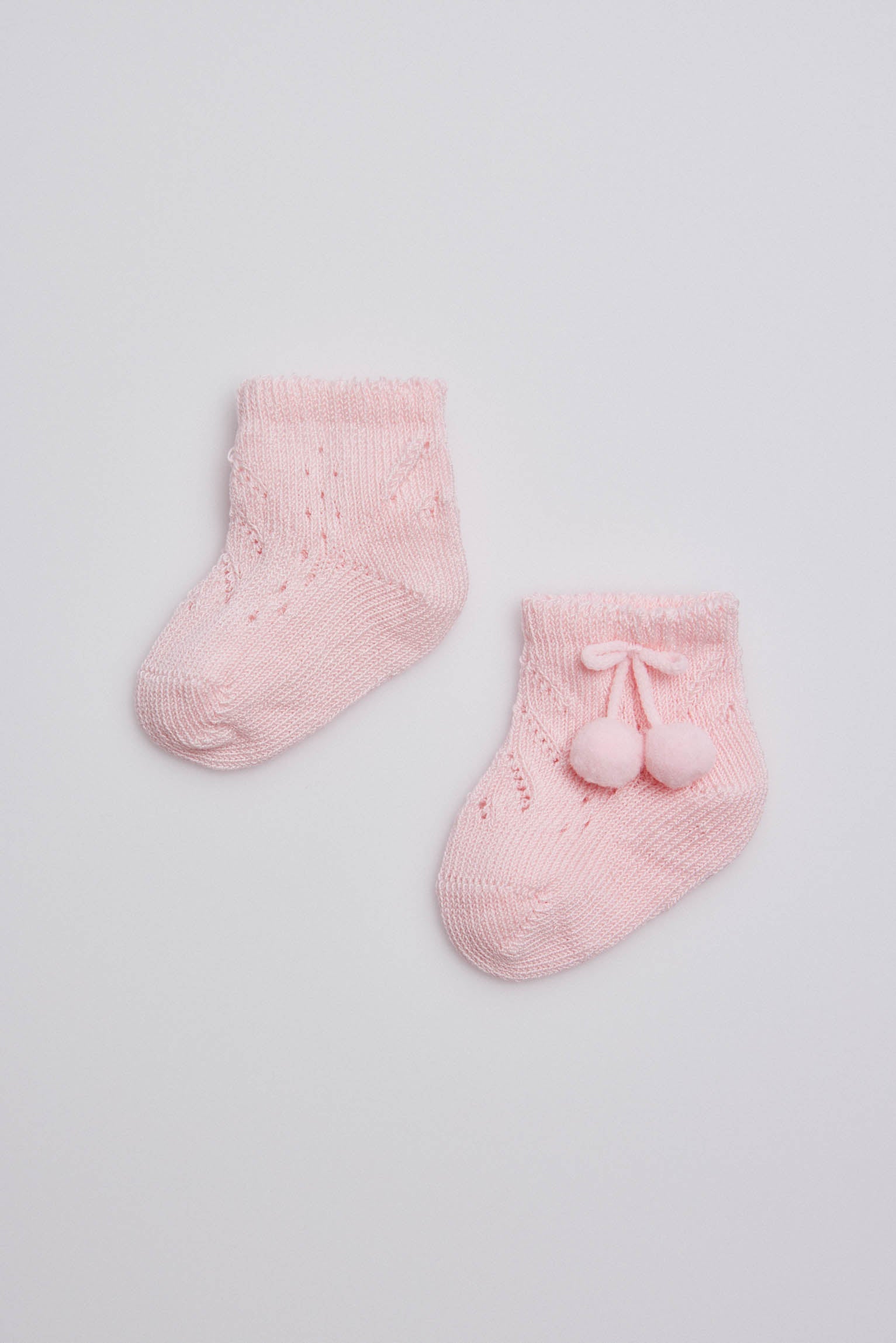 Chaussettes nouveau-né perles roses à pompons