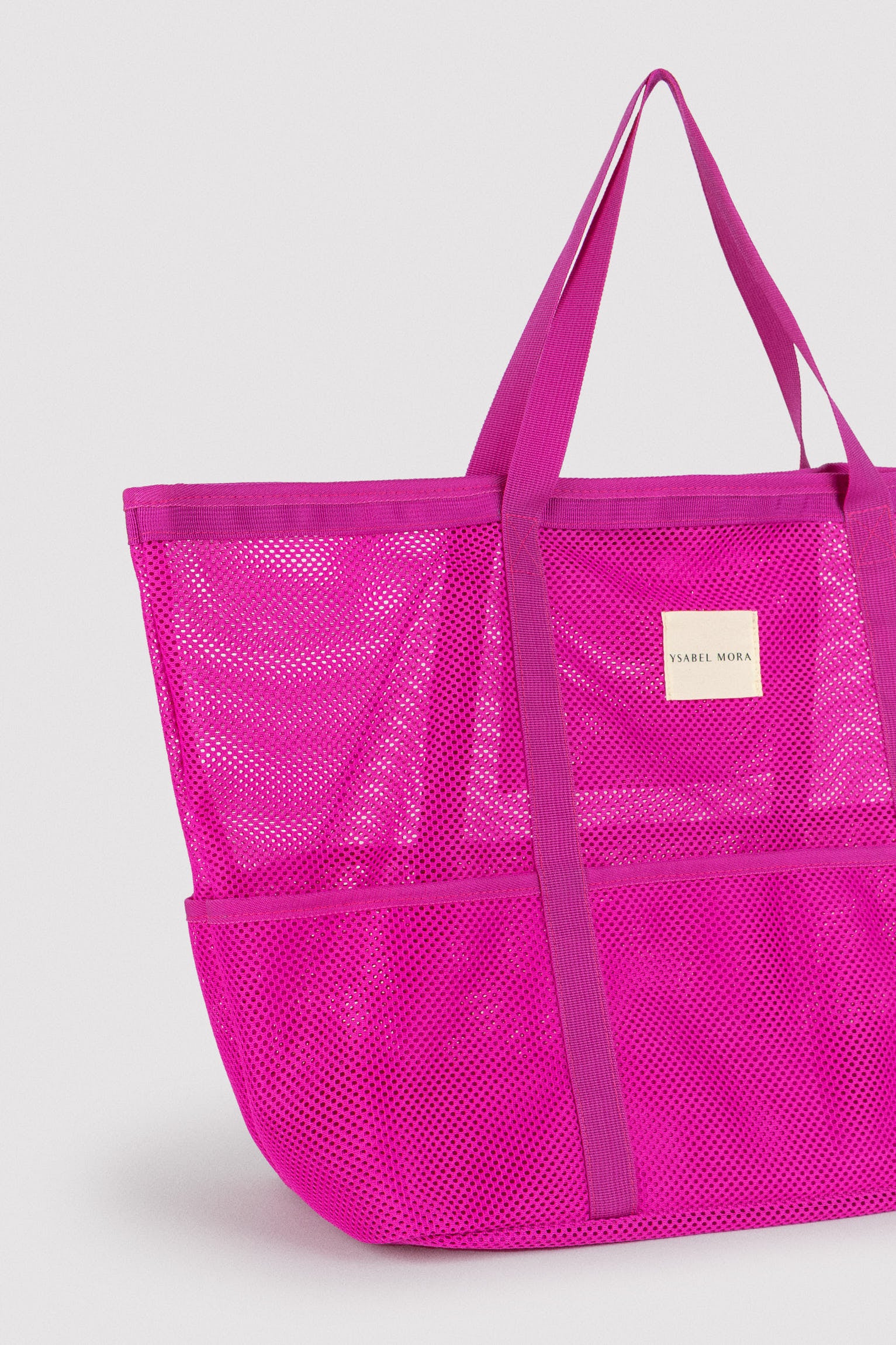 86292-electric-pink-bolsa-de-playa-calada-rosa-ysabel-mora