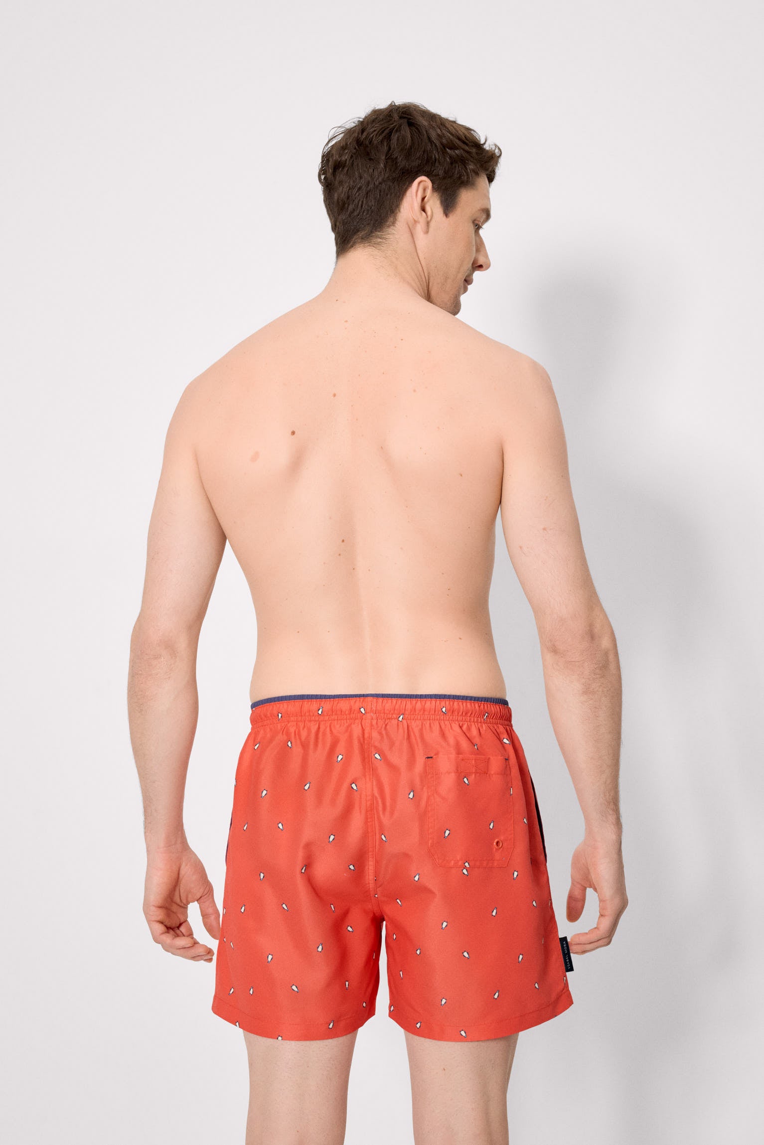 Bañador medio estampado pingüinos naranja - Ysabel Mora