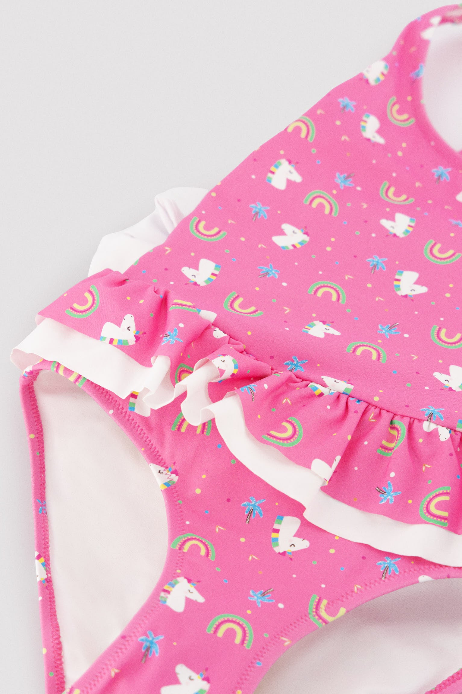 Bañador niña detalles volantes y lazos estampado unicornios - Ysabel Mora
