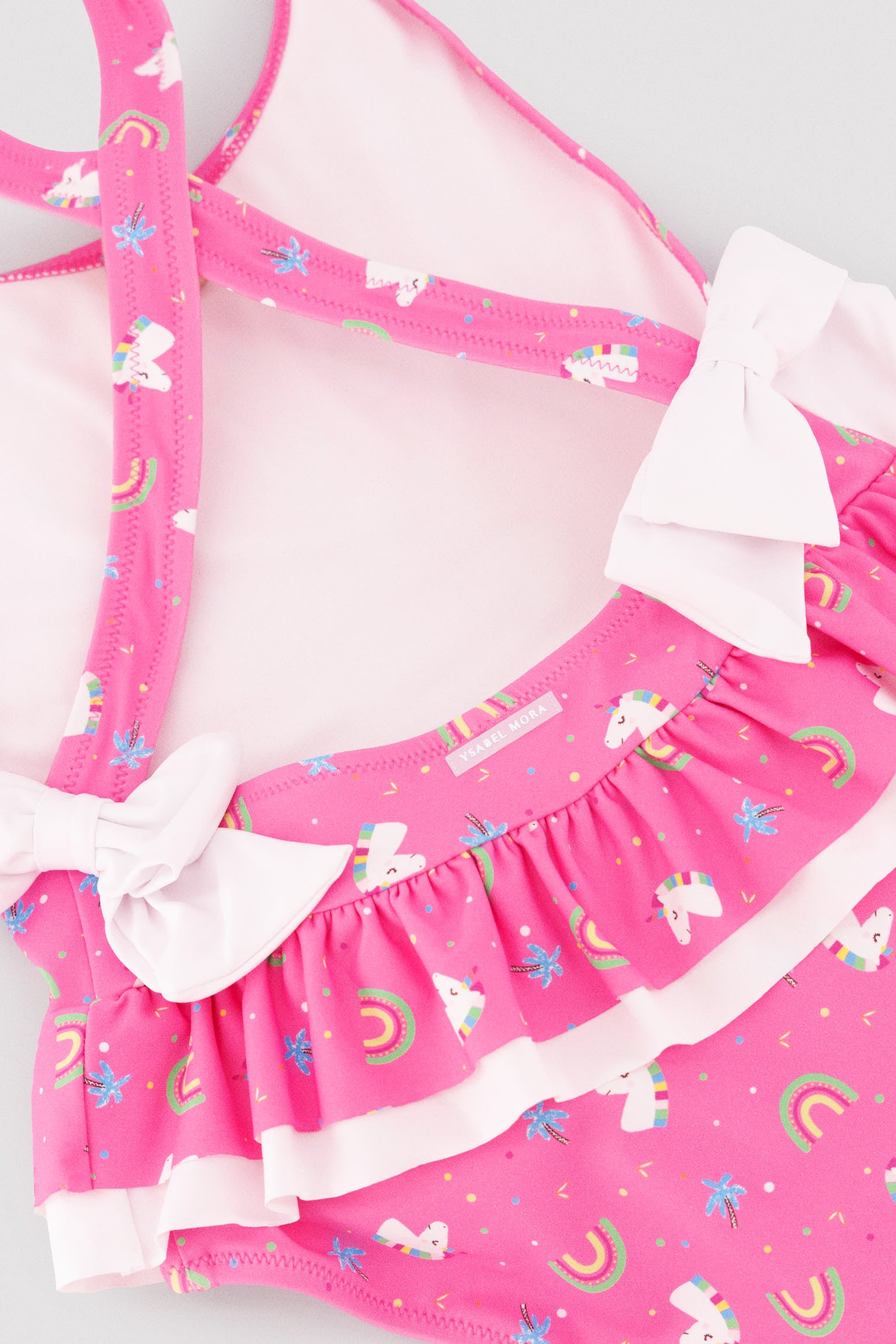 Bañador niña detalles volantes y lazos estampado unicornios - Ysabel Mora